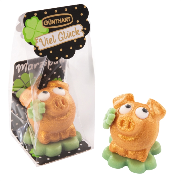 1 Stück Marzipan-Schweinchen gold auf Kleeblatt im Cellophanbeutel 